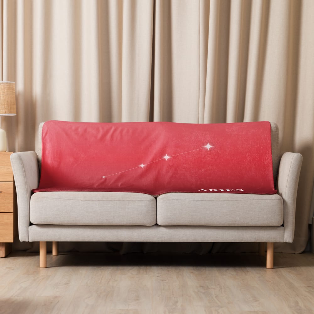 Aries Zodiac Blanket in Poppy in a lifestyle setting