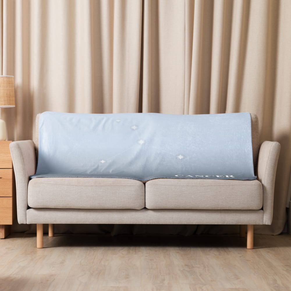 Cancer Zodiac Blanket in Ice Blue in a lifestyle setting