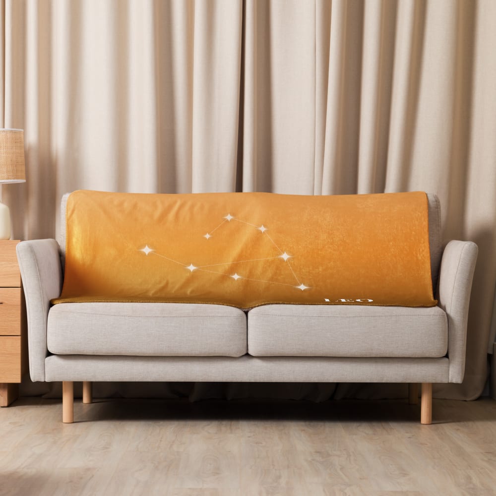 Leo Zodiac Blanket in Tangerine in a lifestyle setting