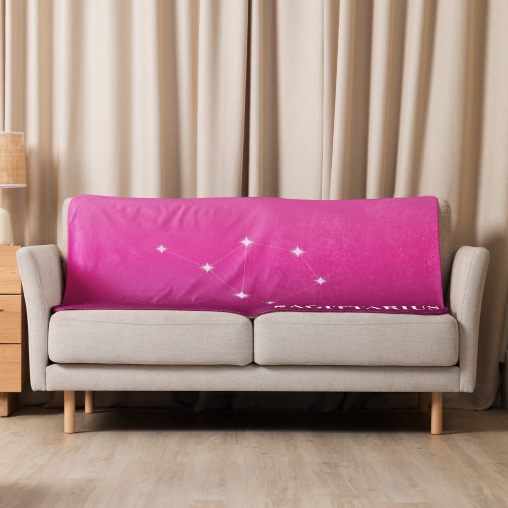 Sagittarius Zodiac Blanket in Fuchsia in a lifestyle setting