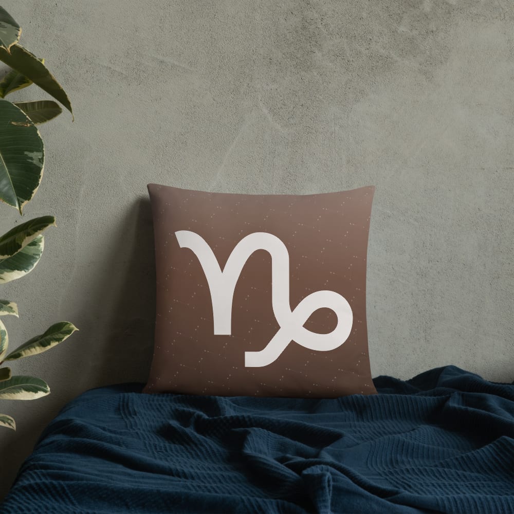 Capricorn Zodiac Pillow in Cocoa in a lifestyle setting