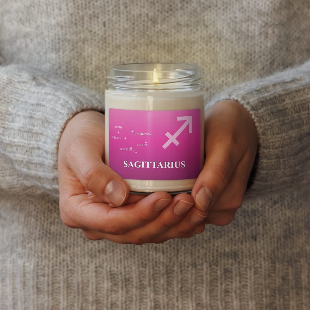Sagittarius Zodiac Candle in Fuchsia in a lifestyle setting