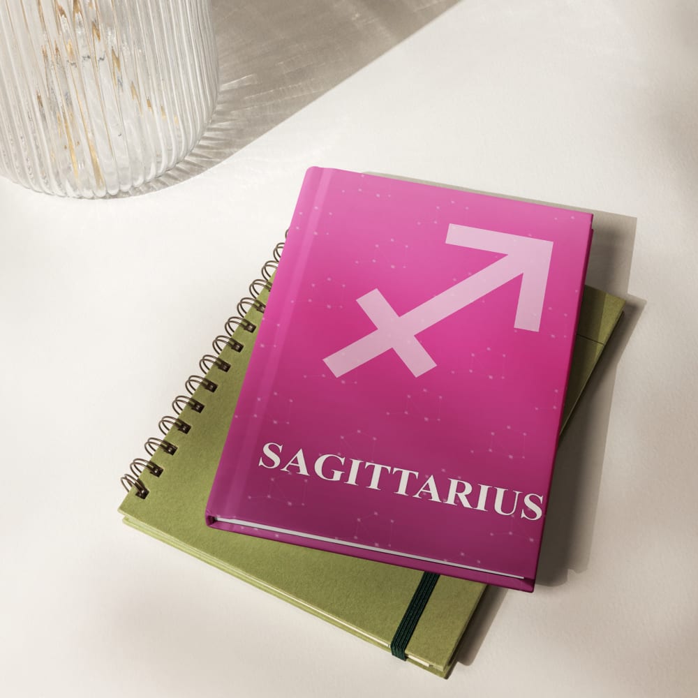 Sagittarius Zodiac Journal in Fuchsia in a lifestyle setting