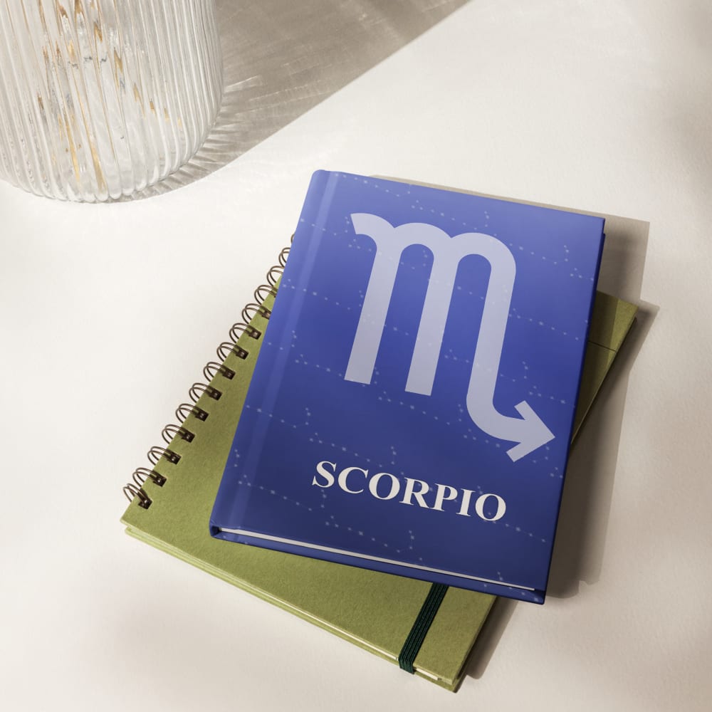 Scorpio Zodiac Journal in Royal Blue in a lifestyle setting